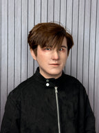 Young male silicone mask with realistic brown hairstyle